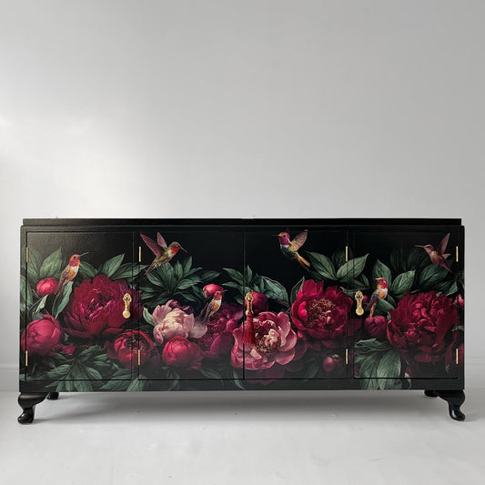 Slim black sideboard with red flowers and birds on the front panels and Queen Anne legs
