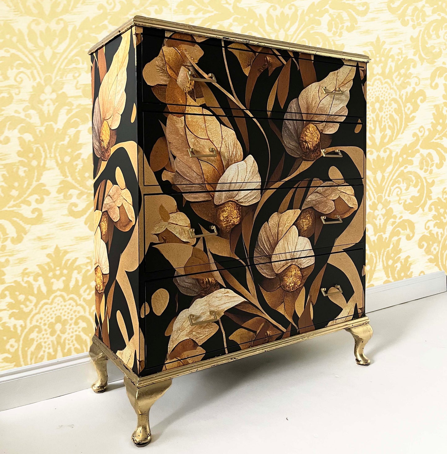 Antique chest of drawers with gold floral pattern